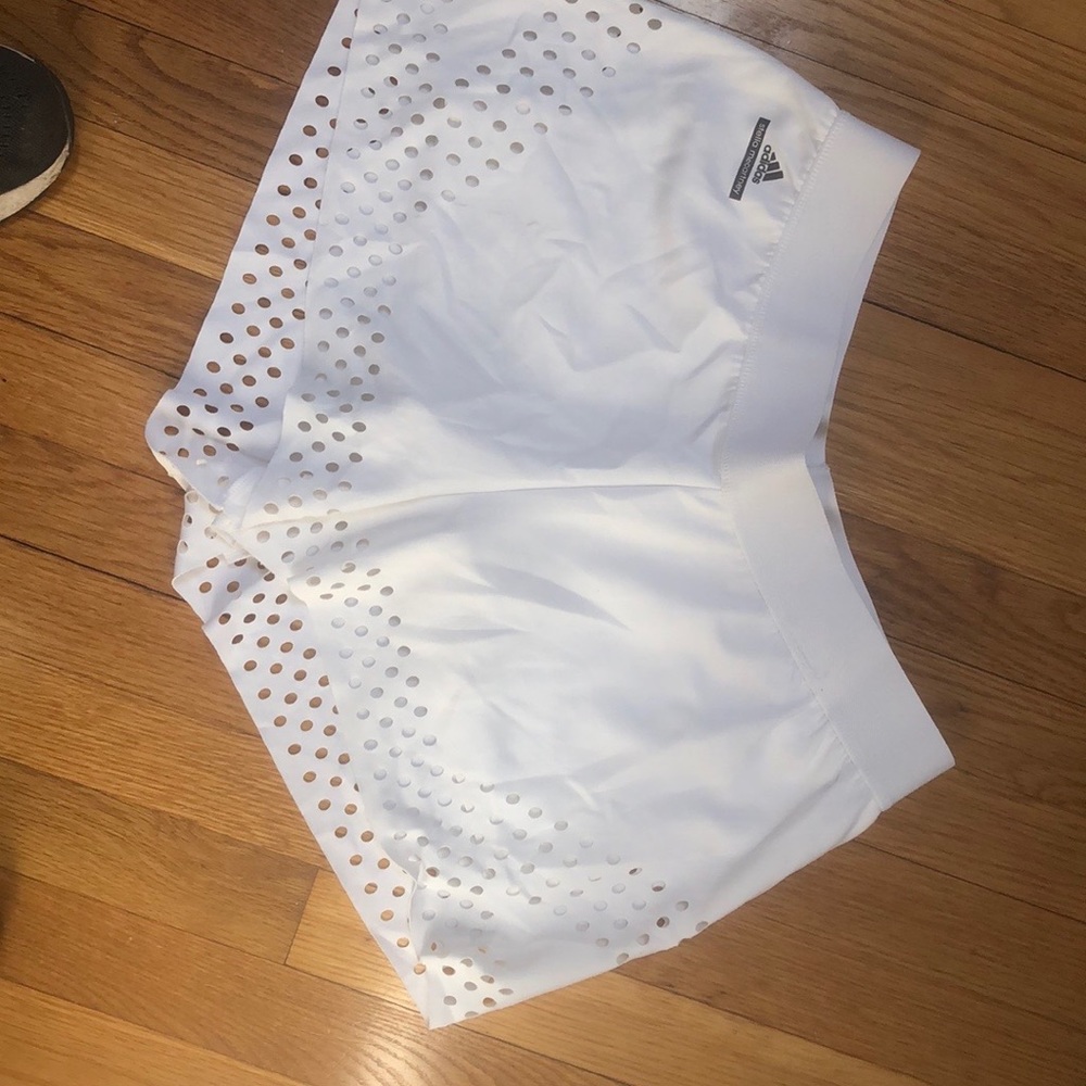 White eyelet edged tennis Adidas Stella McCartney shorts.